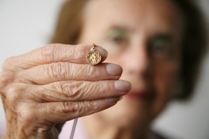 When Lily was a young child in Hungary, her mother gave her this small gold pendant. In July 1944, when Lily was 14 the Nazis deported her from her town of Bonyhad with her mother, brother and three sisters. They were taken by train to Auschwitz. The small pendant went with them hidden inside the heel of her mother’s shoe. As they arrived at the camp her mother asked Lily to swap shoes with her. She never saw her again. The guards ordered valuables to be handed over but her pendant stayed in the heel of her shoe. When the shoes wore out she placed the pendant in her daily ration of bread. After about four months in Auschwitz, the sisters were transferred to an ammunition factory near Leipzig. The pendant went with them. Allied forces liberated Leipzig in 1945 and the sisters sought refuge in Switzerland. Lily tried to rebuild her life. She wore the pendant every day in memory of her murdered family. In 1967 she came to London with her husband and three children. Lily still wears the gold pendant and shares its remarkable story with all those who have time to listen. Any gold arriving in Auschwitz was stolen by the Nazis so Lily believes that her pendant is unique, the only gold to enter and leave the camp with its rightful owner. Like Lily herself, it survived against the odds.